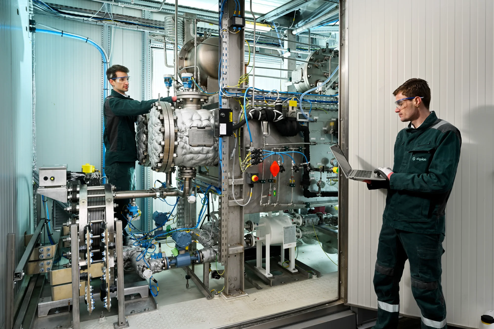 Two Alquion engineers at the Flexolyser pilot installation