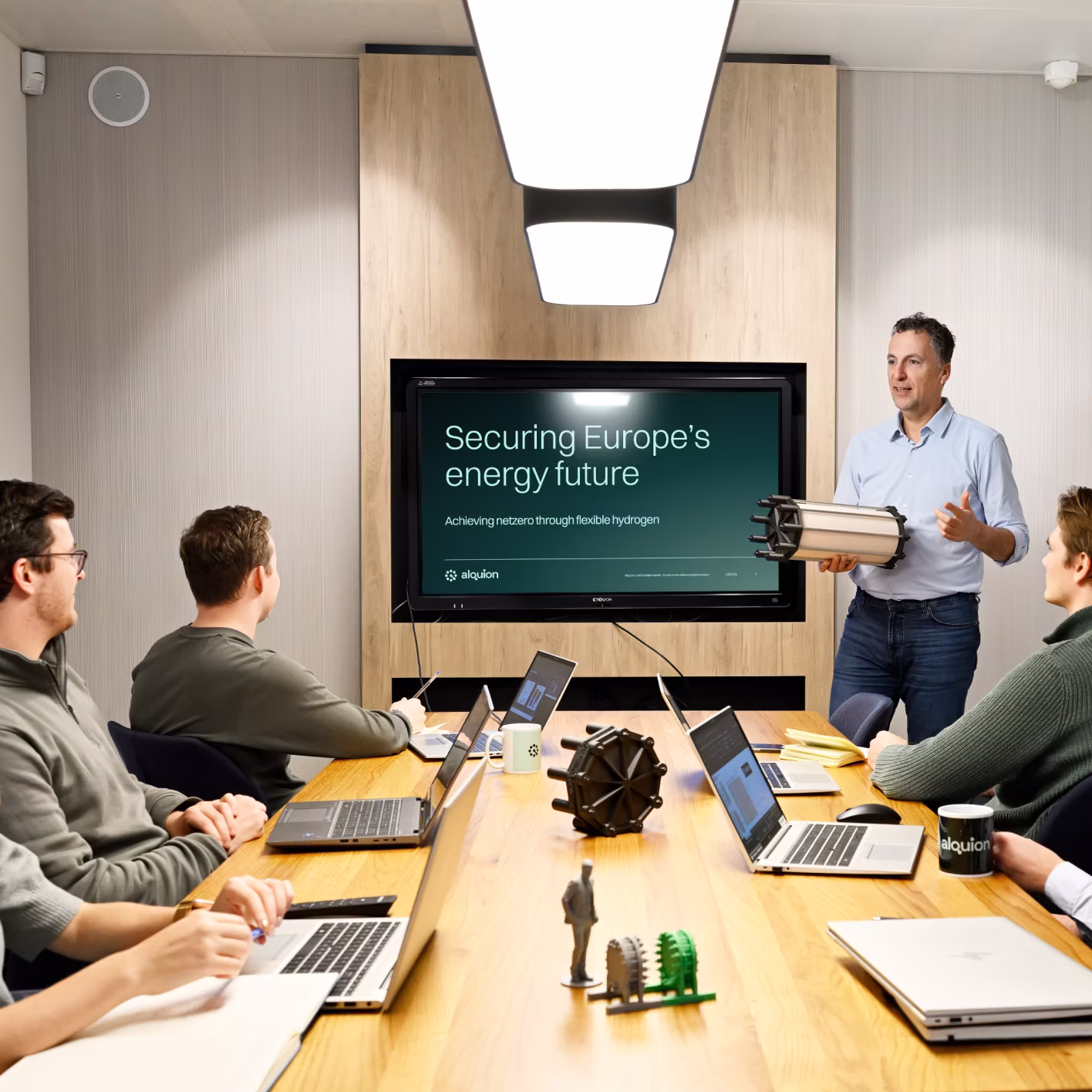 Alquion team in a meeting
